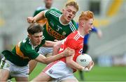 22 June 2019; Jack Cahalane of Cork is tackled by Luke Chester and Alan Dineen of Kerry during the Electric Ireland Munster GAA Football Minor Championship Final match between Cork and Kerry at Páirc Ui Chaoimh in Cork.  Photo by Brendan Moran/Sportsfile