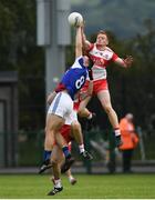 22 June 2019; Conor McAtamney of Derry in action against John O'Loughlin of Laois during the GAA Football All-Ireland Senior Championship Round 2 match between Derry and Laois at Derry GAA Centre of Excellence in Owenbeg, Derry. Photo by Ramsey Cardy/Sportsfile