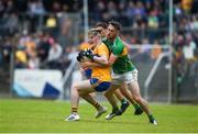 22 June 2019; Gavin Cooney of Clare in action against Conor Reynolds of Leitrim during the GAA Football All-Ireland Senior Championship Round 2 match between Leitrim and Clare at Avantcard Páirc Seán Mac Diarmada in Carrick-on-Shannon, Leitrim. Photo by Daire Brennan/Sportsfile