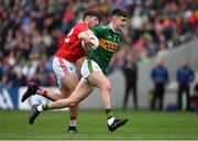 22 June 2019; Sean O'Shea of Kerry is tackled by Tomás Clancy of Cork during the Munster GAA Football Senior Championship Final match between Cork and Kerry at Páirc Ui Chaoimh in Cork.  Photo by Brendan Moran/Sportsfile
