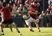 22 June 2019; Lee Keegan of Mayo in action against Conor Poland of Down during the GAA Football All-Ireland Senior Championship Round 2 match between Down and Mayo at Pairc Esler in Newry, Down.  Photo by Oliver McVeigh/Sportsfile