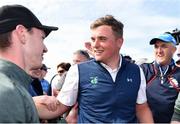 22 June 2019; James Sugrue of Mallow Golf Club, Co. Cork, celebrates with supporters on the 18th green during the final day of the R&A Amateur Championship at Portmarnock Golf Club in Dublin.  Photo by Sam Barnes/Sportsfile