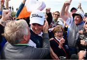 22 June 2019; James Sugrue of Mallow Golf Club, Co. Cork, celebrates with supporters on the 18th green after putting to win the R&A Amateur Championship at Portmarnock Golf Club in Dublin. Photo by Sam Barnes/Sportsfile