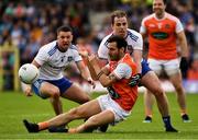 22 June 2019; Jamie Clarke of Armagh is tackled by Ryan Wylie, left, and Conor Boyle of Monaghan during the GAA Football All-Ireland Senior Championship Round 2 match between Monaghan and Armagh at St Tiarnach's Park in Clones, Monaghan.  Photo by Ray McManus/Sportsfile