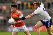 22 June 2019; Aidan Nugent of Armagh is tackled by Kieran Hughes of Monaghan during the GAA Football All-Ireland Senior Championship Round 2 match between Monaghan and Armagh at St Tiarnach's Park in Clones, Monaghan.  Photo by Ray McManus/Sportsfile