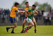 22 June 2019; Gary Plunkett of Leitrim in action against Aaron Fitzgerald, left, and Cillian Brennan of Clare during the GAA Football All-Ireland Senior Championship Round 2 match between Leitrim and Clare at Avantcard Páirc Seán Mac Diarmada in Carrick-on-Shannon, Leitrim. Photo by Daire Brennan/Sportsfile