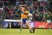 22 June 2019; Cillian Brennan of Clare in action against Pearce Dolan of Leitrim during the GAA Football All-Ireland Senior Championship Round 2 match between Leitrim and Clare at Avantcard Páirc Seán Mac Diarmada in Carrick-on-Shannon, Leitrim. Photo by Daire Brennan/Sportsfile