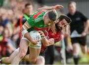 22 June 2019; Evan Regan of Mayo in action against Kevin McKernan of Down during the GAA Football All-Ireland Senior Championship Round 2 match between Down and Mayo at Pairc Esler in Newry, Down.  Photo by Oliver McVeigh/Sportsfile