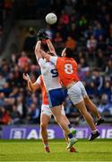 22 June 2019; Kieran Hughes of Monaghan jumps with Armagh players Aaron Forker, 8, and Brendan Donaghy in an effort to win possession during the GAA Football All-Ireland Senior Championship Round 2 match between Monaghan and Armagh at St Tiarnach's Park in Clones, Monaghan.  Photo by Ray McManus/Sportsfile