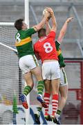22 June 2019; David Moran of Kerry gets to the ball ahead of Ian Maguire of Cork in the final seconds of the Munster GAA Football Senior Championship Final match between Cork and Kerry at Páirc Ui Chaoimh in Cork.  Photo by Brendan Moran/Sportsfile