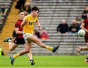 23 June 2019; Eoghan McMenamin of Antrim in action against John McGeough of Down during the EirGrid Ulster GAA Football U20 Championship Round match between Down and Antrim at St Tiernach's Park in Clones, Monaghan. Photo by Oliver McVeigh/Sportsfile