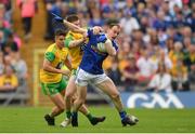 23 June 2019; Martin Reilly of Cavan is tackled by Eoghan Bán Gallagher of Donegal during the Ulster GAA Football Senior Championship Final match between Donegal and Cavan at St Tiernach's Park in Clones, Monaghan. Photo by Ramsey Cardy/Sportsfile