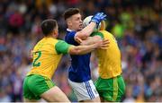 23 June 2019; Dara McVeety of Cavan in action against Paddy McGrath, left, and Hugh McFadden of Donegal during the Ulster GAA Football Senior Championship Final match between Donegal and Cavan at St Tiernach's Park in Clones, Monaghan. Photo by Sam Barnes/Sportsfile