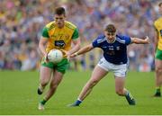 23 June 2019; Eoghan Ban Gallagher of Donegal in action against Gerard Smith of Cavan during the Ulster GAA Football Senior Championship Final match between Donegal and Cavan at St Tiernach's Park in Clones, Monaghan. Photo by Oliver McVeigh/Sportsfile