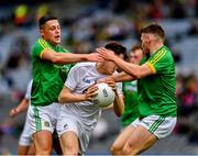 23 June 2019; Eoghan Lawless of Kildare is tackled by Robin Clarke, left, and James Cassidy of Meath during the Leinster Junior Football Championship Final match between Meath and Kildare at Croke Park in Dublin. Photo by Ray McManus/Sportsfile