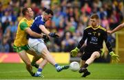 23 June 2019; Conor Rehill of Cavan misses a goal chance under pressure from Neil McGee, left, and Shaun Patton of Donegal during the Ulster GAA Football Senior Championship Final match between Donegal and Cavan at St Tiernach's Park in Clones, Monaghan. Photo by Sam Barnes/Sportsfile