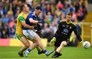 23 June 2019; Conor Rehill of Cavan misses a goal chance under pressure from Neil McGee, left, and Shaun Patton of Donegal during the Ulster GAA Football Senior Championship Final match between Donegal and Cavan at St Tiernach's Park in Clones, Monaghan. Photo by Sam Barnes/Sportsfile