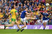 23 June 2019; Gearoid McKiernan of Cavan in scores a point, despite the attentions of Neil McGee of Donegal during the Ulster GAA Football Senior Championship Final match between Donegal and Cavan at St Tiernach's Park in Clones, Monaghan. Photo by Sam Barnes/Sportsfile