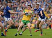 23 June 2019; Niall O’Donnell  of Donegal in action against Oisin Kiernan and Killian Clarke of Cavan during the Ulster GAA Football Senior Championship Final match between Donegal and Cavan at St Tiernach's Park in Clones, Monaghan. Photo by Oliver McVeigh/Sportsfile