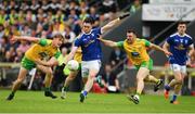 23 June 2019; Conor Rehill of Cavan in action against Paddy McGrath, right, and Hugh McFadden of Donegal during the Ulster GAA Football Senior Championship Final match between Donegal and Cavan at St Tiernach's Park in Clones, Monaghan. Photo by Sam Barnes/Sportsfile