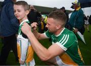 23 June 2019; Anton Sullivan of Offaly signs the jersey of Aaron Mooney, aged six, from Tullamore, Co. Offaly following the GAA Football All-Ireland Senior Championship Round 2 match between Offaly and Sligo at Bord na Mona O'Connor Park in Tullamore, Offaly. Photo by Harry Murphy/Sportsfile