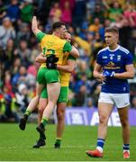 23 June 2019; Jamie Brennan of Donegal, left, and Michael Murphy celebrate at the final whistle as Killian Clarke of Cavan leaves the field dejected following the Ulster GAA Football Senior Championship Final match between Donegal and Cavan at St Tiernach's Park in Clones, Monaghan. Photo by Sam Barnes/Sportsfile