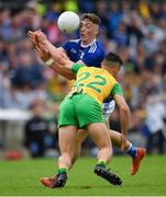 23 June 2019; Conor Brady of Cavan in action against Odhrán McFadden Ferry of Donegal during the Ulster GAA Football Senior Championship Final match between Donegal and Cavan at St Tiernach's Park in Clones, Monaghan. Photo by Ramsey Cardy/Sportsfile