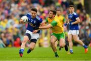 23 June 2019; Conor Moynagh of Cavan in action against Daire Ó Baoill of Donegal during the Ulster GAA Football Senior Championship Final match between Donegal and Cavan at St Tiernach's Park in Clones, Monaghan. Photo by Ramsey Cardy/Sportsfile