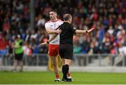 22 June 2019; Michael Cassidy of Tyrone with referee Derek O'Mahoney during the GAA Football All-Ireland Senior Championship Round 2 match between Longford and Tyrone at Glennon Brothers Pearse Park in Longford.  Photo by Eóin Noonan/Sportsfile