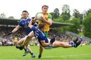23 June 2019; Hugh McFadden of Donegal in action against Conor Rehill, left, and Padraig Faulkner of Cavan during the Ulster GAA Football Senior Championship Final match between Donegal and Cavan at St Tiernach's Park in Clones, Monaghan. Photo by Ramsey Cardy/Sportsfile