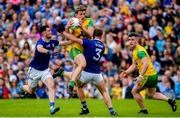 23 June 2019; Hugh McFadden of Donegal in action against Conor Rehill and Padraig Faulkner of Cavan during the Ulster GAA Football Senior Championship Final match between Donegal and Cavan at St Tiernach's Park in Clones, Monaghan. Photo by Oliver McVeigh/Sportsfile