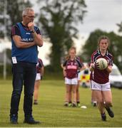 22 June 2019; Galway manager Padraig Kilcommins watches on during the warm-up prior to the Ladies Football All-Ireland U14 Platinum Final 2019 match between Cork and Galway at St Rynaghs in Banagher, Offaly. Photo by Ben McShane/Sportsfile