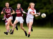 22 June 2019; Katie O'Driscoll of Cork and Gráinne Molloy, centre, of Galway during the Ladies Football All-Ireland U14 Platinum Final 2019 match between Cork and Galway at St Rynaghs in Banagher, Offaly. Photo by Ben McShane/Sportsfile