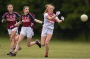 22 June 2019; Katie O'Driscoll of Cork and Gráinne Molloy, centre, of Galway during the Ladies Football All-Ireland U14 Platinum Final 2019 match between Cork and Galway at St Rynaghs in Banagher, Offaly. Photo by Ben McShane/Sportsfile