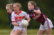 22 June 2019; Eabha Curran of Cork in action against Róisín Reddington of Galway during the Ladies Football All-Ireland U14 Platinum Final 2019 match between Cork and Galway at St Rynaghs in Banagher, Offaly. Photo by Ben McShane/Sportsfile