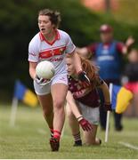 22 June 2019; Lia Heffernan of Cork evades the tackle of Niamh Divilly of Galway during the Ladies Football All-Ireland U14 Platinum Final 2019 match between Cork and Galway at St Rynaghs in Banagher, Offaly. Photo by Ben McShane/Sportsfile