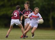 22 June 2019; Ciara O'Brien of Cork in action against Gráinne Molloy, 5, and Molly Boote of Galway during the Ladies Football All-Ireland U14 Platinum Final 2019 match between Cork and Galway at St Rynaghs in Banagher, Offaly. Photo by Ben McShane/Sportsfile