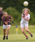 22 June 2019; Lily Murray of Cork and Neasa Daly of Galway during the Ladies Football All-Ireland U14 Platinum Final 2019 match between Cork and Galway at St Rynaghs in Banagher, Offaly. Photo by Ben McShane/Sportsfile