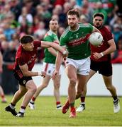 22 June 2019; Aidan O'Shea of Mayo in action against Donal O'Hare of Down  during the GAA Football All-Ireland Senior Championship Round 2 match between Down and Mayo at Pairc Esler in Newry, Down.  Photo by Oliver McVeigh/Sportsfile