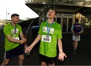 27 June 2019; Jamie Fallon of Winters Property Management is soaked by team-mate Thomas Cafferty after winning the Grant Thornton Corporate 5K Team Challenge Galway at Ballybrit Racecourse in Galway. Photo by Diarmuid Greene/Sportsfile
