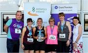 27 June 2019; Womens Team Race winners Mary-Teresa Cooney, Helen Corless, Catherina Diskin Hunt, and Andrea Diskin of Sminkys are presented with their trophy by Aengus Burns of Grant Thornton and Karen Golden from Galway Simon Community after the Grant Thornton Corporate 5K Team Challenge Galway at Ballybrit Racecourse in Galway. Photo by Diarmuid Greene/Sportsfile