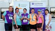 27 June 2019; Jackie Ryan, Aine Lydon, Julie Murphy, and Maretta O Shea of Penn Engineering, who finished 3rd in the Womens Team Race, are presented with their trophy by Aengus Burns of Grant Thornton and Karen Golden from Galway Simon Community after the Grant Thornton Corporate 5K Team Challenge Galway at Ballybrit Racecourse in Galway. Photo by Diarmuid Greene/Sportsfile