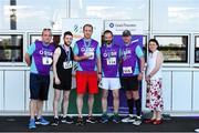 27 June 2019; Alan Flannery, Thomas Scarry, Gordon Nolan and Mark Moran of Penn Engineering, who finished 2nd in the Mens Team Race, are presented with their trophy by Aengus Burns of Grant Thornton and Karen Golden from Galway Simon Community after the Grant Thornton Corporate 5K Team Challenge Galway at Ballybrit Racecourse in Galway. Photo by Diarmuid Greene/Sportsfile