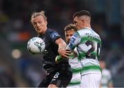 28 June 2019; John Mountney of Dundalk in action against Trevor Clarke of Shamrock Rovers during the SSE Airtricity League Premier Division match between Shamrock Rovers and Dundalk at Tallaght Stadium in Dublin. Photo by Eóin Noonan/Sportsfile