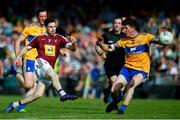 29 June 2019; James Dolan of Westmeath takes a shot at goal, despite the attentions of Aaron Fitzgerald of Clare during the GAA Football All-Ireland Senior Championship Round 3 match between Westmeath and Clare at TEG Cusack Park in Mullingar, Westmeath. Photo by Sam Barnes/Sportsfile