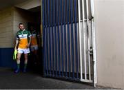29 June 2019; Niall Darby of Offaly checks if Laois have taken their team photo before he leads his side out to the pitch ahead of the GAA Football All-Ireland Senior Championship Round 3 match between Laois and Offaly at O'Moore Park in Portlaoise, Laois. Photo by Eóin Noonan/Sportsfile