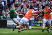 29 June 2019; Fionn McDonagh of Mayo scores his side's first goal despite the efforts of Aaron McKay and Aidan Nugent of Armagh during the GAA Football All-Ireland Senior Championship Round 3 match between Mayo and Armagh at Elverys MacHale Park in Castlebar, Mayo. Photo by Brendan Moran/Sportsfile