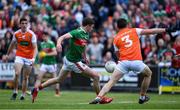 29 June 2019; Fionn McDonagh of Mayo scores his side's first goal despite the efforts of Aaron McKay of Armagh during the GAA Football All-Ireland Senior Championship Round 3 match between Mayo and Armagh at Elverys MacHale Park in Castlebar, Mayo. Photo by Brendan Moran/Sportsfile