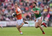 29 June 2019; Mark Shields of Armagh in action against Aidan O’Shea of Mayo during the GAA Football All-Ireland Senior Championship Round 3 match between Mayo and Armagh at Elverys MacHale Park in Castlebar, Mayo. Photo by Ben McShane/Sportsfile