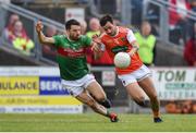 29 June 2019; Jamie Clarke of Armagh in action against Chris Barrett of Mayo during the GAA Football All-Ireland Senior Championship Round 3 match between Mayo and Armagh at Elverys MacHale Park in Castlebar, Mayo. Photo by Ben McShane/Sportsfile